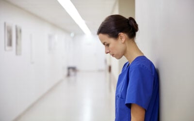 Hospital employee requesting a disability accommodation before being wrongfully terminated, illustrating ADA disability discrimination, reasonable accommodation, and retaliation claims.