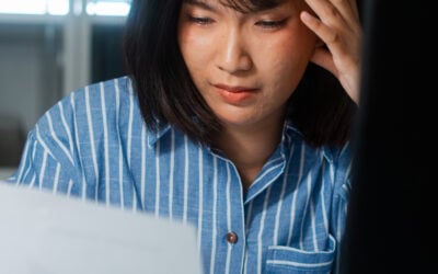 Employee reviewing FMLA leave, disability accommodation, performance write-ups, and termination records after being wrongfully fired